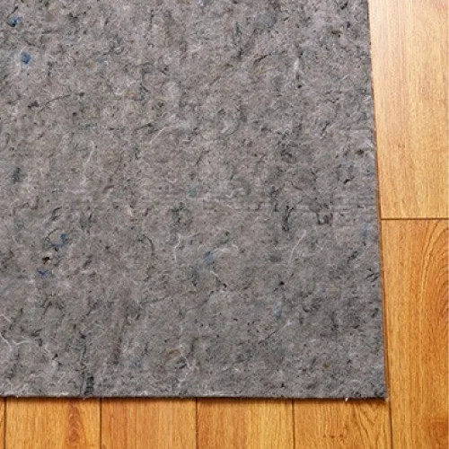 An image of an area rug pad over hardwood floor